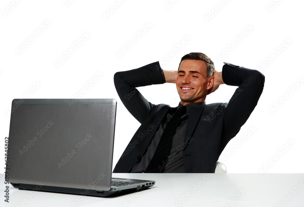Relaxed happy businessman sitting at the table Relaxed happy businessman sitting at the table