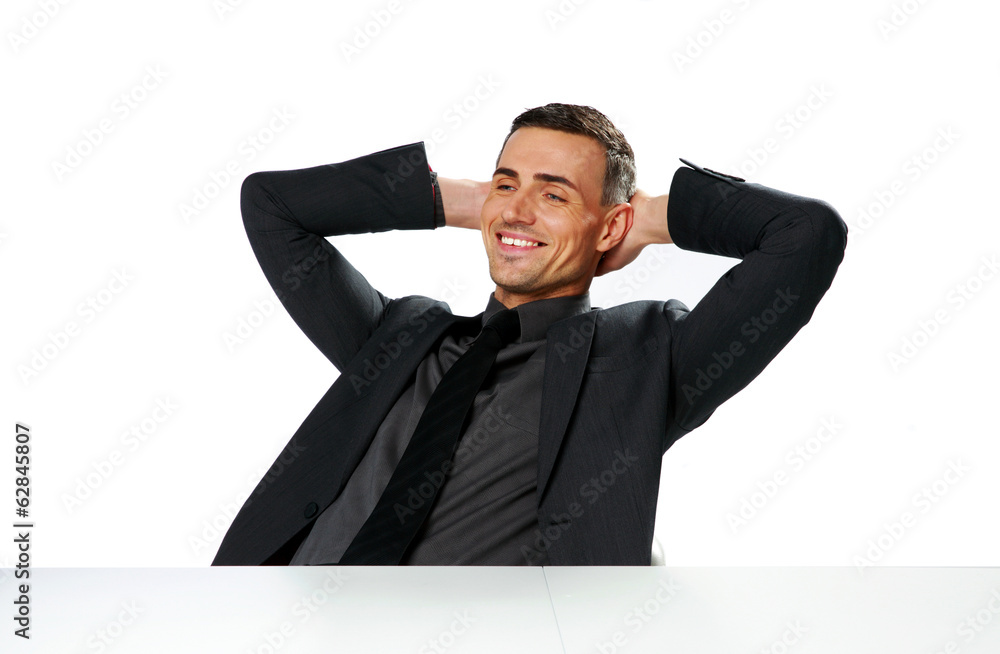 Relaxed happy businessman sitting at the table Relaxed happy businessman sitting at the table