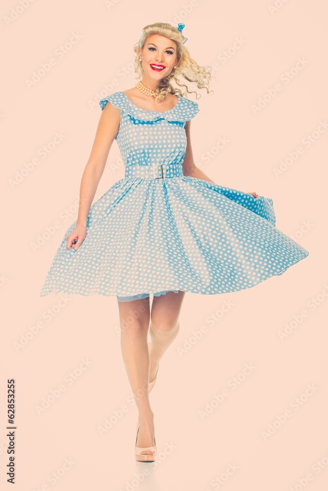 Sexy coquette blond pin up style young woman in blue dress Sexy coquette blond pin up style young woman in blue dress