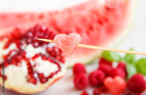 Fresh organic fruits and berrys: rapsberyy, watermelon, pomegran photo