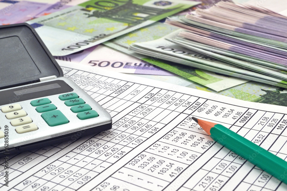 Image of calculator with money 100 and 500 euro Image of calculator with money 100 and 500 euro