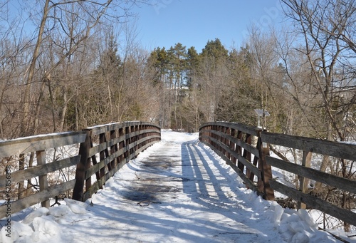 Snow covered wooden bridge