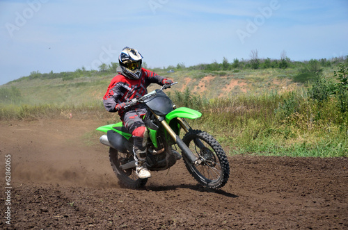 Fototapeta Naklejka Na Ścianę i Meble -  X games MX rider on a motorcycle in a bend
