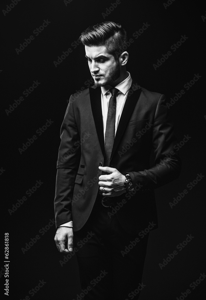 Portrait of handsome stylish man in elegant black suit Portrait of handsome stylish man in elegant black suit