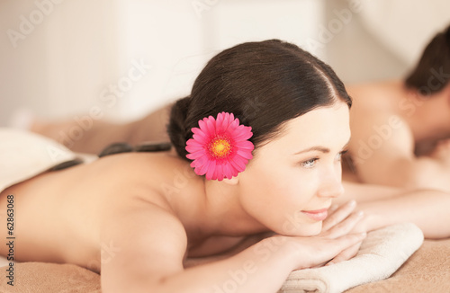 woman in spa with hot stones