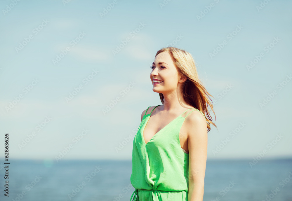 girl standing on the beach
