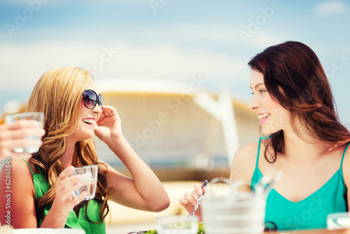 girls in cafe on the beach