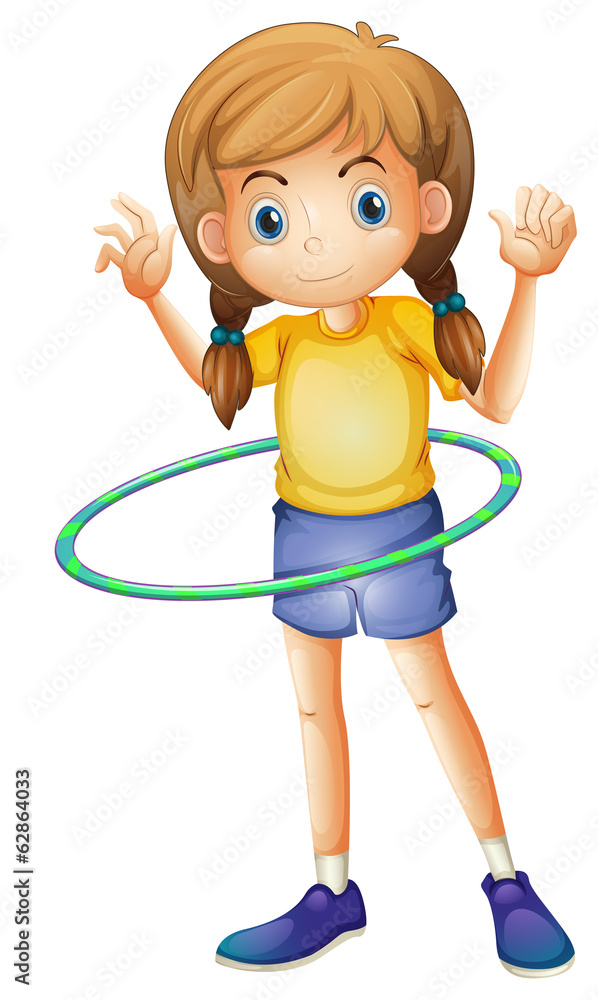 A young girl playing with the hulahoop A young girl playing with the hulahoop