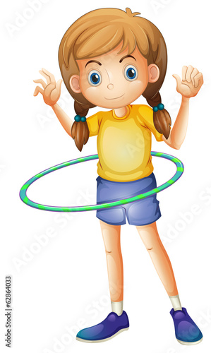 A young girl playing with the hulahoop