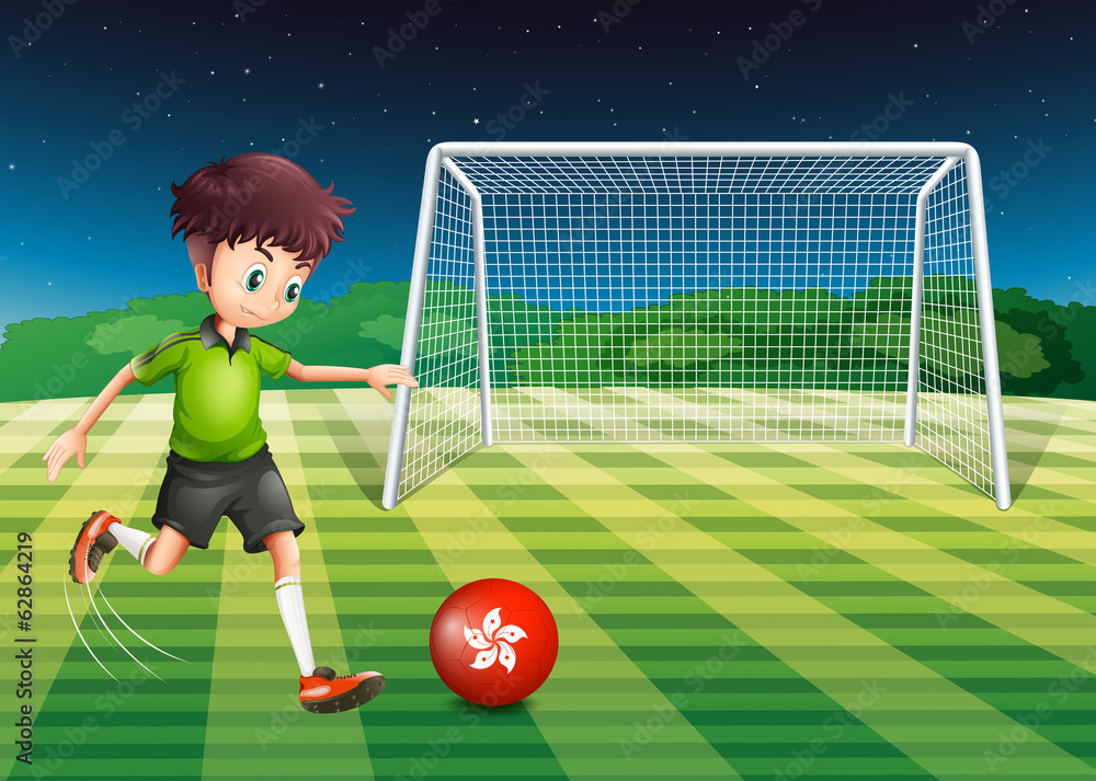Fototapeta premium A young man kicking the ball with the flag of Hongkong
