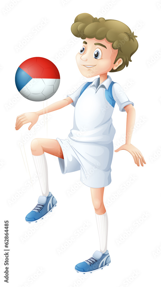 A boy playing with the ball from Czech Republic A boy playing with the ball from Czech Republic