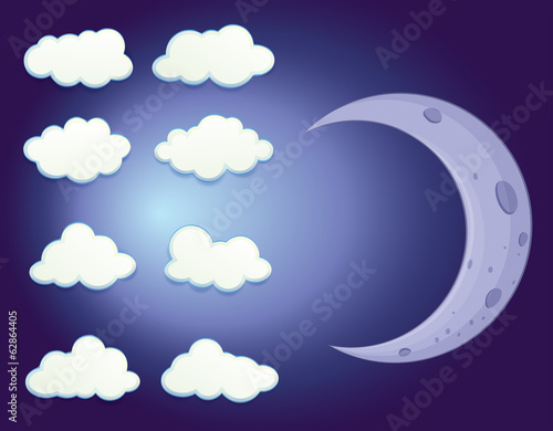 A sky with clouds and a moon