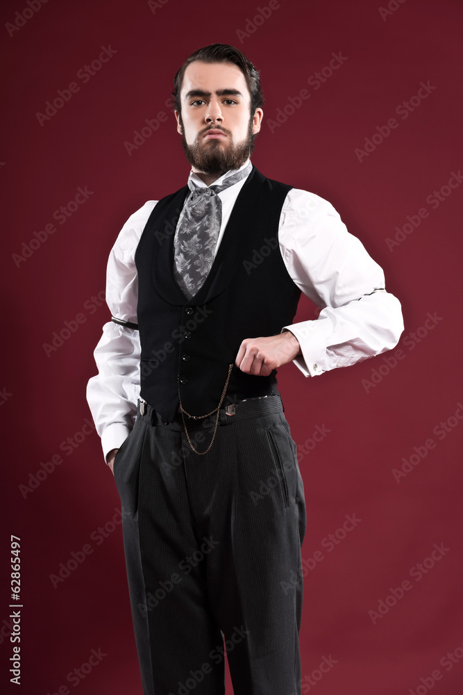 Obraz premium Retro 1900 victorian fashion man with beard wearing black gilet
