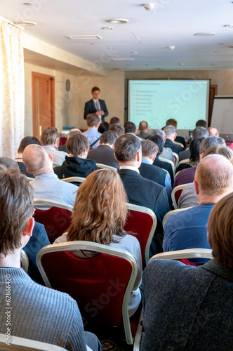 people sitting rear at the business conference