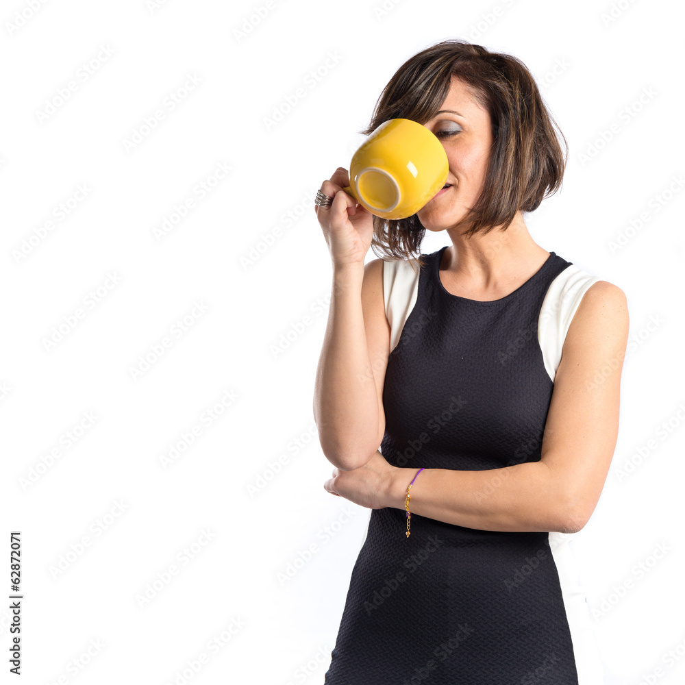 Pretty girl drinking coffee over white background Pretty girl drinking coffee over white background