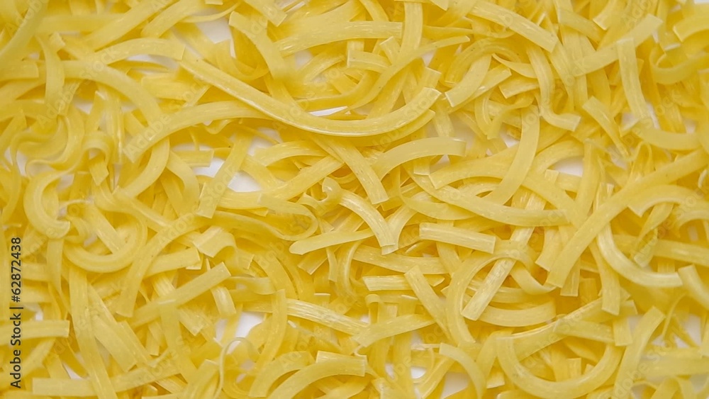 Uncooked pasta as background Uncooked pasta as background