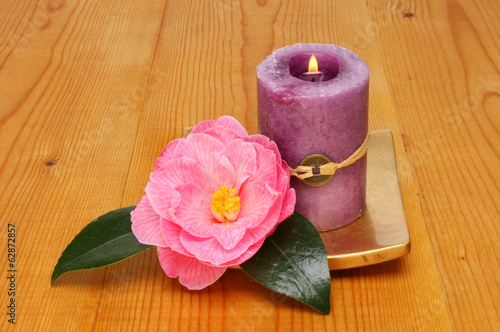 Candle and camellia