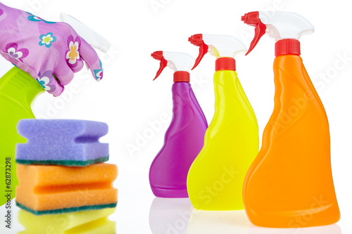 Colorful cleaning products isolated over white