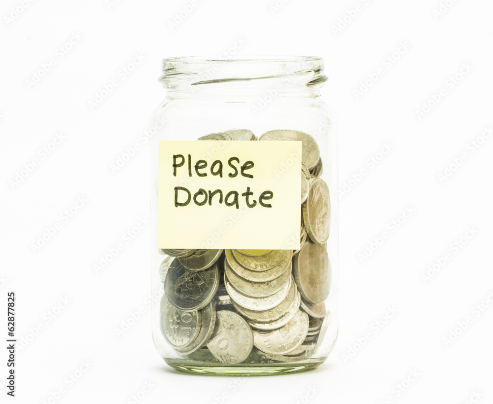 Isolated coins in jar with please donate label Isolated coins in jar with please donate label