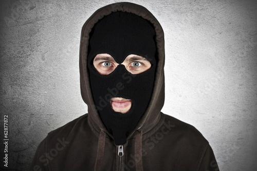 фотографія Criminal wearing military mask