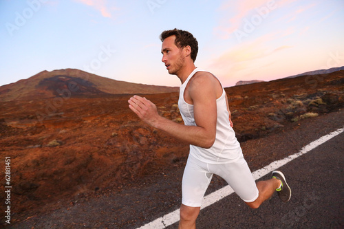 Man running on road in beautiful nature