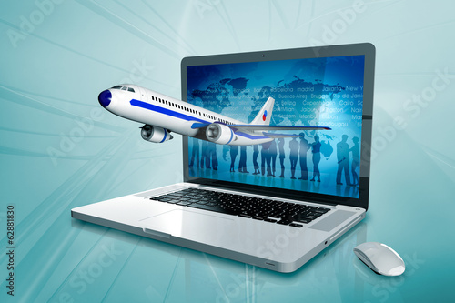 a laptop with a worldmap and plane on the screen