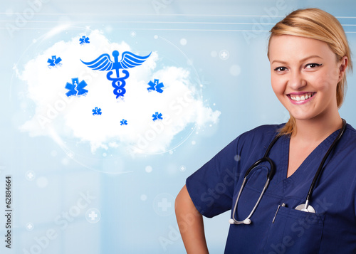 Young doctor with abstract cloud and medical icons photo