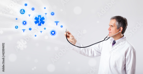 Doctor with blue medical icons photo