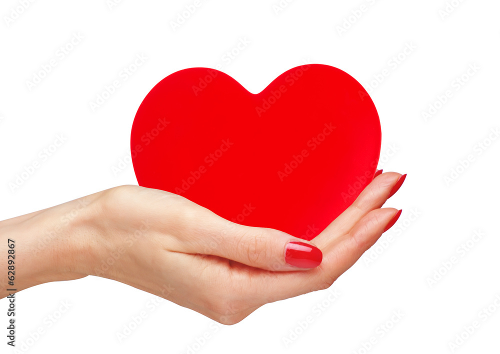 Red heart in woman hands isolated on white Red heart in woman hands isolated on white