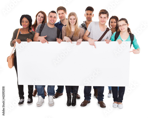 College Students Displaying Blank Billboard photo