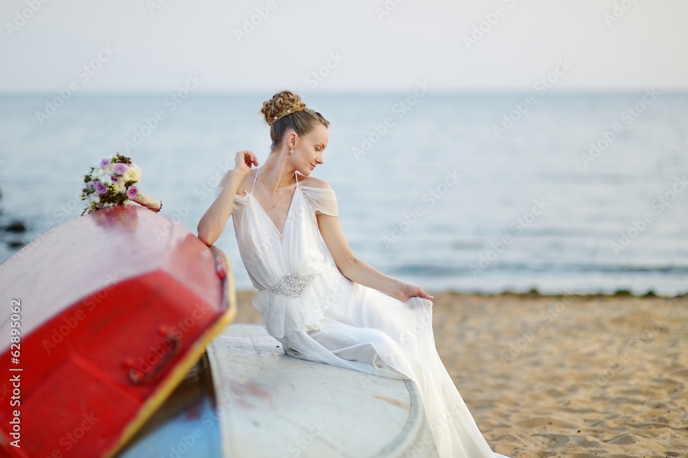Beautiful bride sitting on a boat