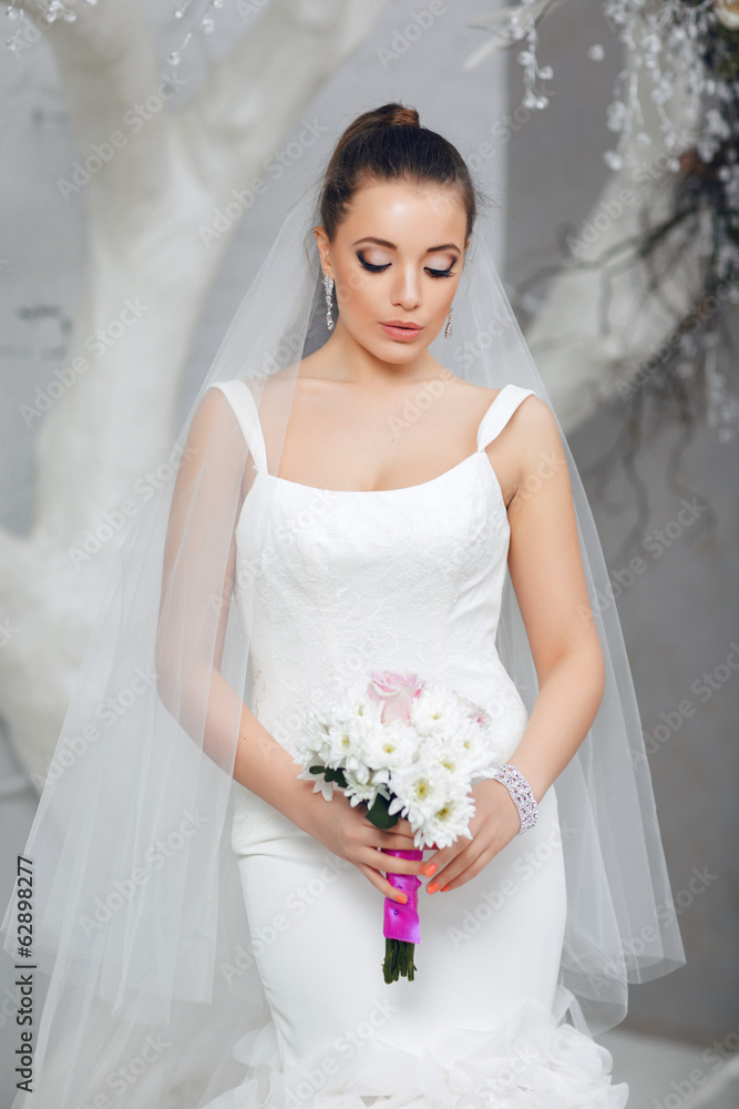Portrait of bride with beautiful wedding bouquet