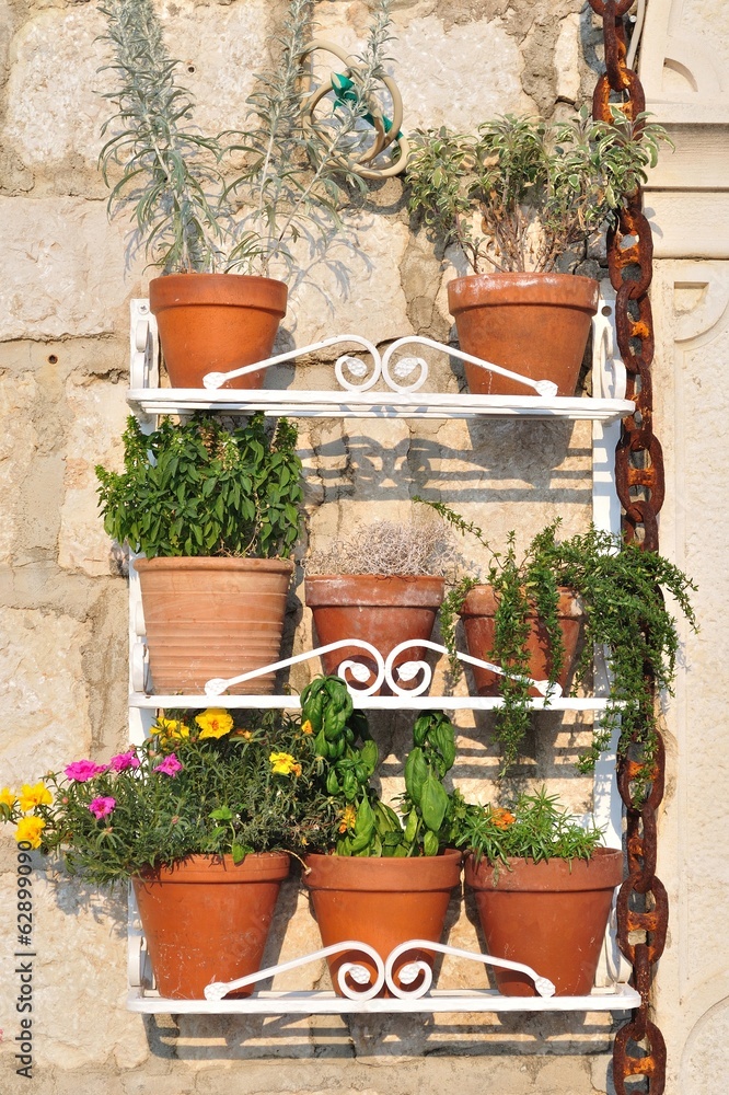 Outdoor flowerpot decoration hanging on house wall