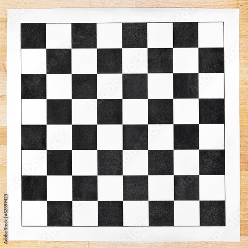 Fototapeta black and white vinyl checkerboard on wooden table
