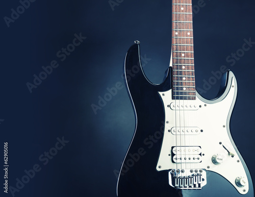Modern electric guitar. Toned in blue