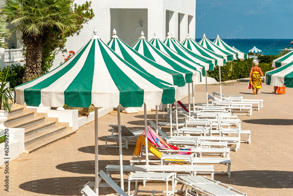 Row of Sun Loungers with Sunshades