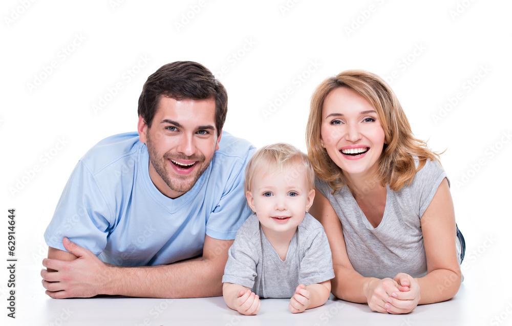 Smiling young family with little child. Smiling young family with little child.