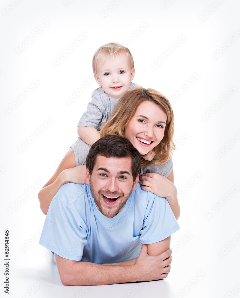Smiling young family with little child. Smiling young family with little child.