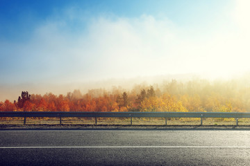 autumn road in sunset time
