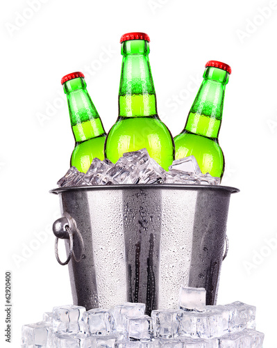 Beer bottles in ice bucket isolated