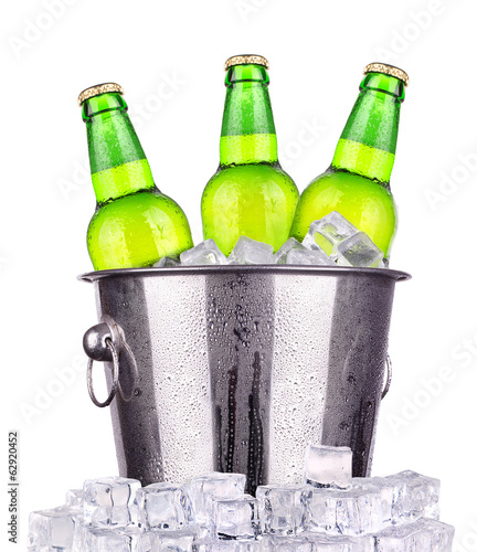 Beer bottles in ice bucket isolated