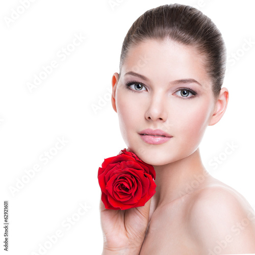 Beautiful young woman with red rose.