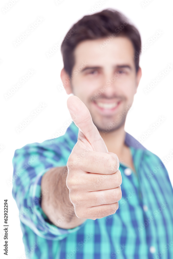 Handsome latin man thumbs up over a white background Handsome latin man thumbs up over a white background
