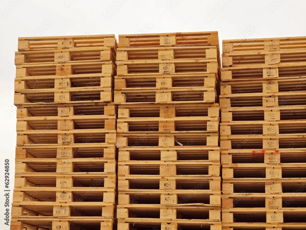 Stock of new wooden euro pallets at transportation company.