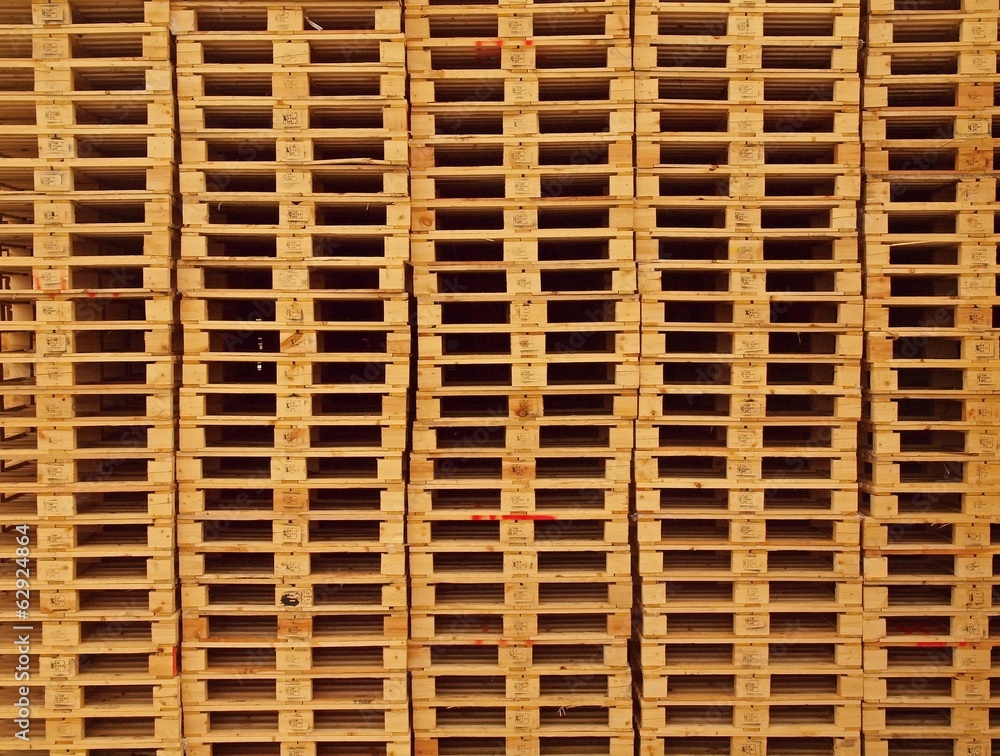 Texture of wooden euro pallets stocked in high column Texture of wooden euro pallets stocked in high column