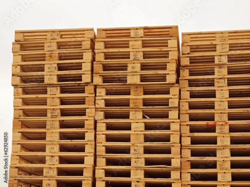 Stock of new wooden euro pallets at transportation company.