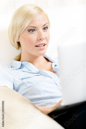 Close up of woman sitting with silver pc