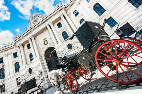 Fiaker carriages at Hofburg Palace in Vienna, Austria photo