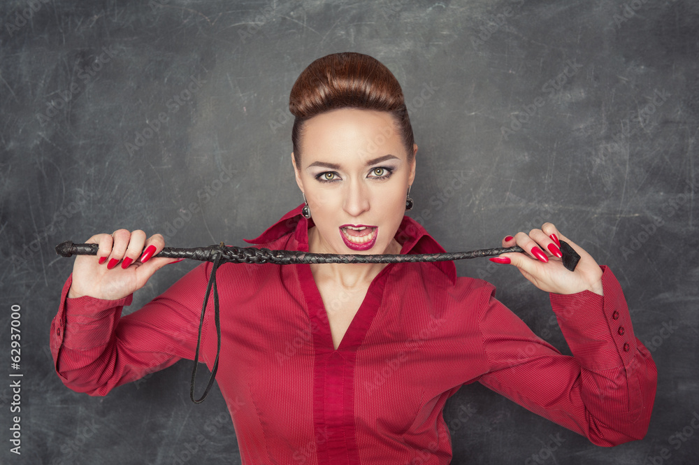 Woman with whip in her hands Stock Photo