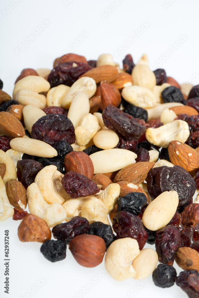 mixed nuts and dried fruits isolated on white background mixed nuts and dried fruits isolated on white background